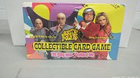Front view of the sealed 1999 Austin Powers Collectible Card Game box showing character images and colorful packaging.