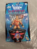 Front view of Ken Shamrock WWF Superstars Series 5 action figure in original package with autograph signed in red ink on the plastic.