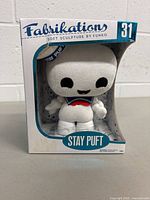 Front side of the Funko Fabrikations Stay Puft plush soft sculpture in box.