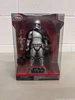Front view of sealed Captain Phasma die cast figure packaging showing figure and accessory inside box.