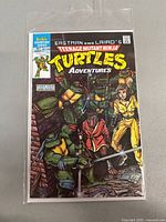 Front view of the first issue comic book in protective sleeve showing cover art and title.