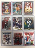 Nine Tom Brady football cards arranged in a 3x3 grid in protective cases showing various card designs.