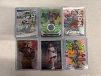 Six 2021 Trevor Lawrence rookie football cards presented in two rows of three, showing front of each card with various designs and conditions.