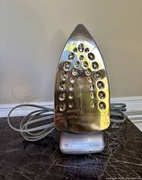 Top view of the Shark steam iron showing the soleplate with multiple steam vents.