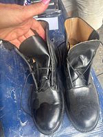 Front view of both boots showing uppers, lacing area, tongue and interior lining