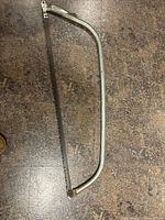 Full view of metal frame bucksaw