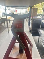 Front view of red Motomaster 2-ton axle stand