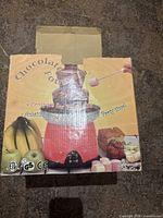 Front of carton showing chocolate fountain image and graphics