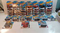 Overview of all 30 Hot Wheels cars in packaging arranged in rows