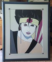 Full view of the framed "Sushi Girl" serigraph showing the entire artwork and frame in natural light.
