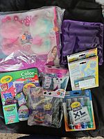 Full lot display including Pomsies Twin Pack, Crayola products, plush toy and activity books