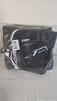 Easton E100T baseball tote bag, folded and sealed in original plastic packaging showing product branding and tag.