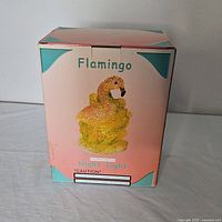 Box of flamingo night light, showing product illustration and branding on front.