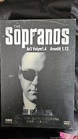 Front cover of The Sopranos Season 3 Volume 1.4 DVD box showing Tony Soprano image with French and Asian text.