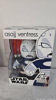 Front view of the original retail box with the Asajj Ventress Mighty Muggs figure visible inside, displaying the character design and Star Wars branding.