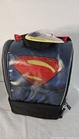 Front view of Thermos cooler bag showing Superman logo on blue textured front panel