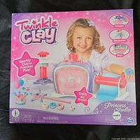Front of the Twinkle Clay Princess Studio box showing sparkly clay craft kit with quick air dryer and princess-themed molds