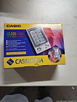 Original Casio Cassiopeia box showing product branding, specs, and image of device