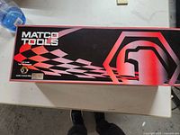 Matco Tools branded box with dragster model inside, top view showing packaging details and branding.