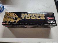 Closed box of the Matco Tools diecast Top Fuel Dragster showing branding and 2003 limited edition details.