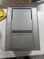 Top view of the Panasonic TR-5050P with closed cassette compartment showing Panasonic logo and overall metal casing.