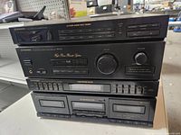 Front view of the stacked Pioneer audio components including cassette decks and receiver.