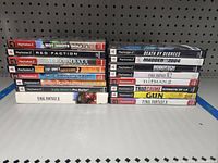 Two stacks of 16 PlayStation 2 game cases arranged showing titles.