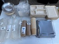 Overall view of assorted disposable containers, lids, cups, trays, bowls