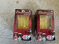 Front view of two boxed Budweiser Super Bowl XL glasses