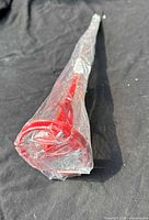 Full view of red paint mixer sealed in plastic