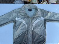 Front view of jacket showing color panels, zipper, pockets