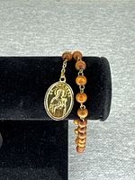Bracelet with St. Therese side of medal visible