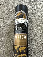 Close view of tube showing Scratch Map Deluxe branding