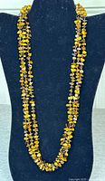 Full view of tiger eye chip necklace displayed on bust