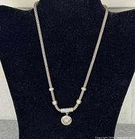 Full view of woven chain necklace displayed on bust