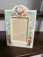 Front view showing Humpty Dumpty nursery design and photo opening