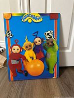 Front view of poster showing characters and logo