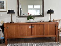 Full front view of teak sideboard with sliding doors