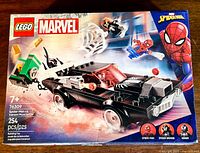 Front of the box showing Lego Marvel Spider-Man vs Venom Muscle Car set with Spider-Man, Spider-Woman, and Venom minifigures and the muscle car model.