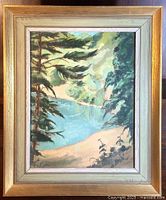 Framed oil painting depicting a landscape with trees and water, showing the entire artwork and frame.