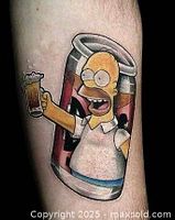 Tattoo of Homer Simpson holding a beer in front of a large can on skin, showcasing bold color and cartoon style.