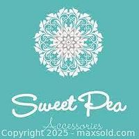 Logo signage of Sweet Pea Boutique showing the brand's name with floral design above