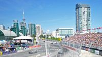 Event view showing the downtown Toronto street circuit with grandstand seating and crowd.