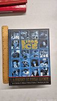 Front cover showing the book title Kings of the Ice with several ice hockey player photos in black and white.
