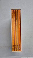 Four Penguin orange spine books titled 'Writers from the Other Europe' in a white slipcase, spine view showing author names and titles.