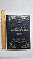Front cover of 'The Complete Works of William Shakespeare' by Cambridge University Press showing title, editor, and decorative gold designs.