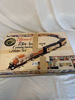 Outer cardboard box for Lionel 75th Anniversary Commemorative Train Set, showing box art of diesel locomotive and train cars