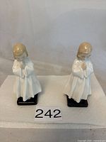Two Royal Doulton Bedtime figurines side by side showing full front profile on a white background.