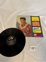 Vinyl record with RCA Victor label and front album jacket showing Elvis Presley in Hawaiian attire