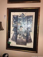 Framed kimono painting hanging on wall, showing overall condition and frame.